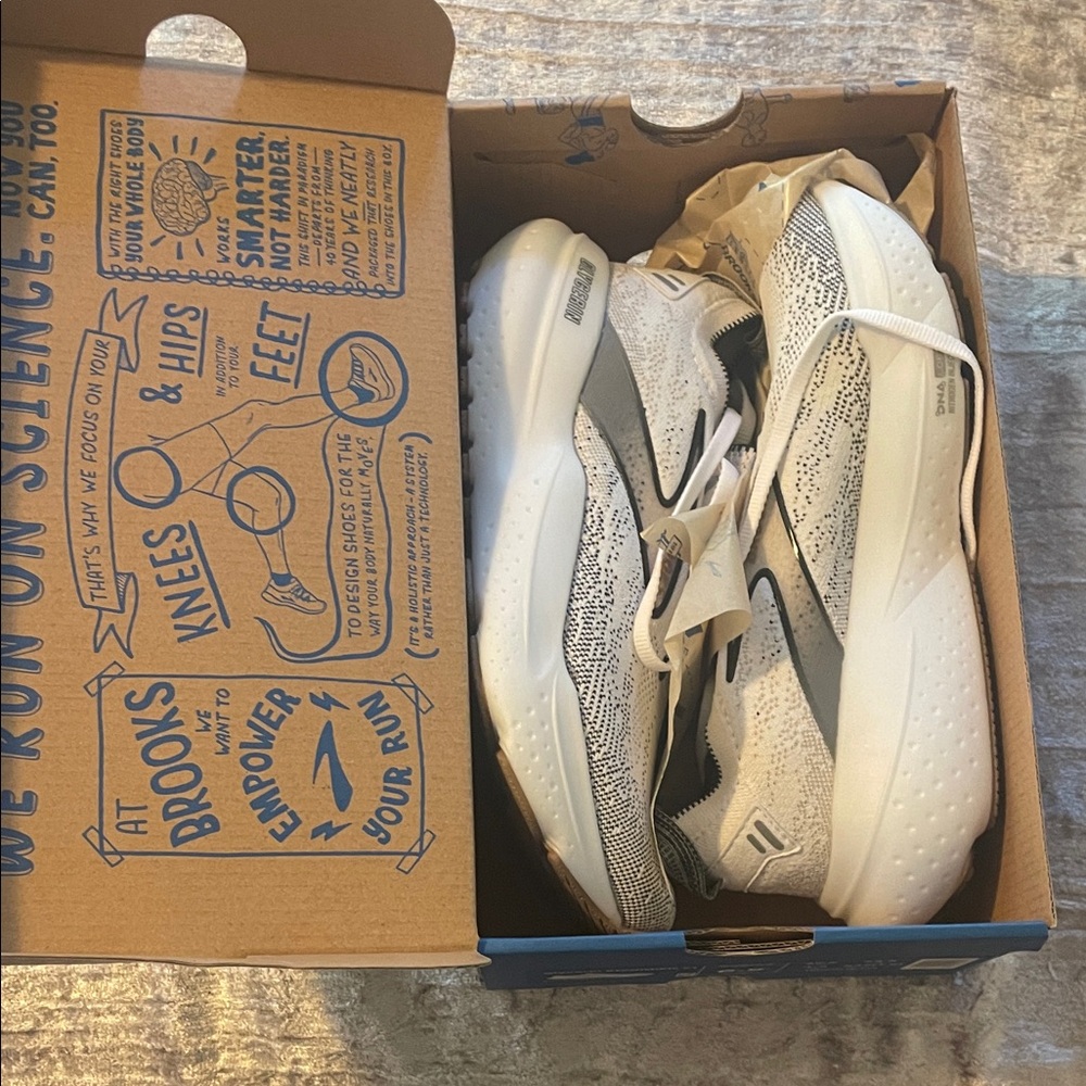 Brooks Kids Sneakers - White and Black size 6 1/2 woman’s sneaker. Worn once.